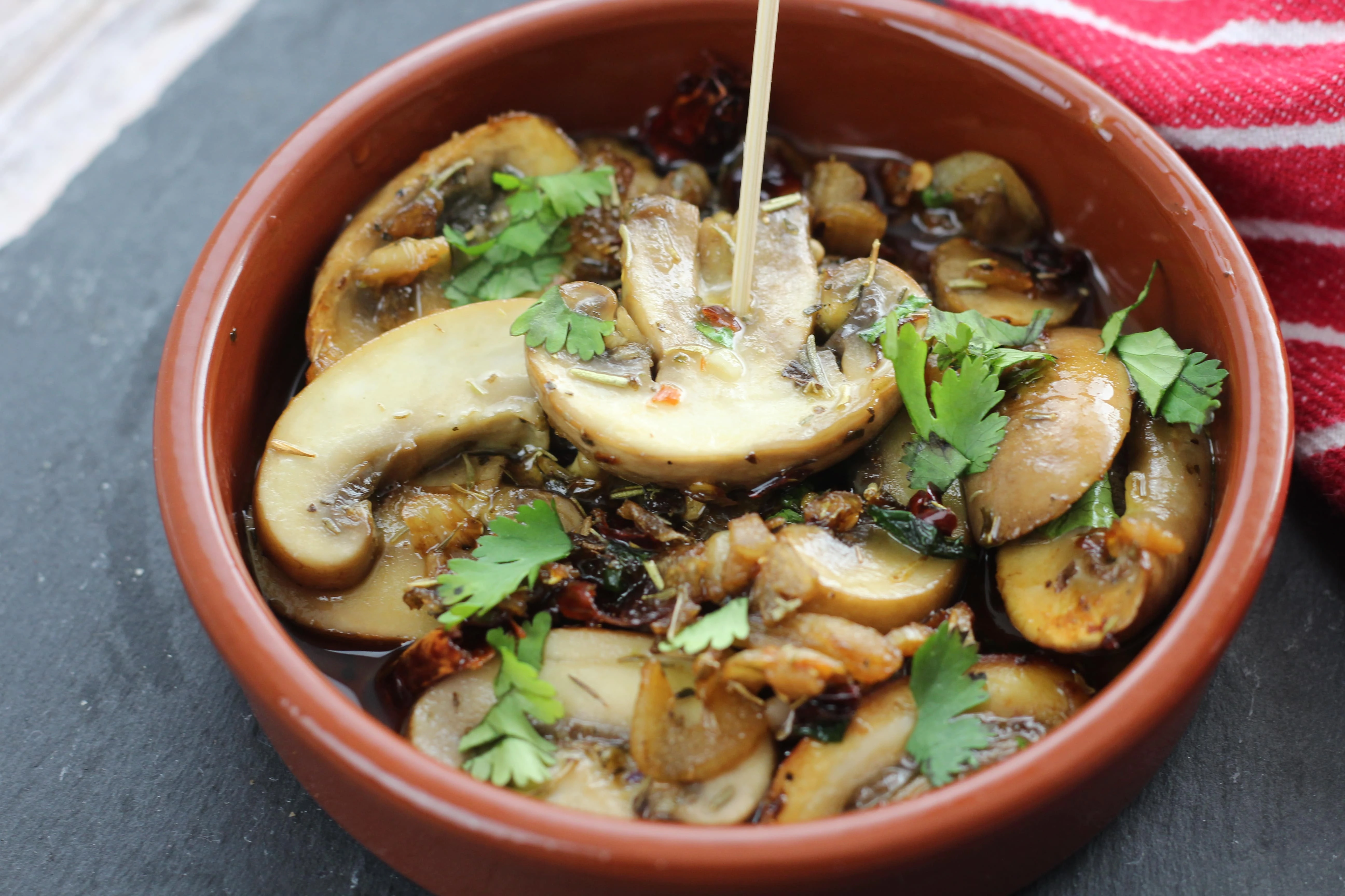 Photo of one of Gav's recipes for a mushroom dish in a red bowl.